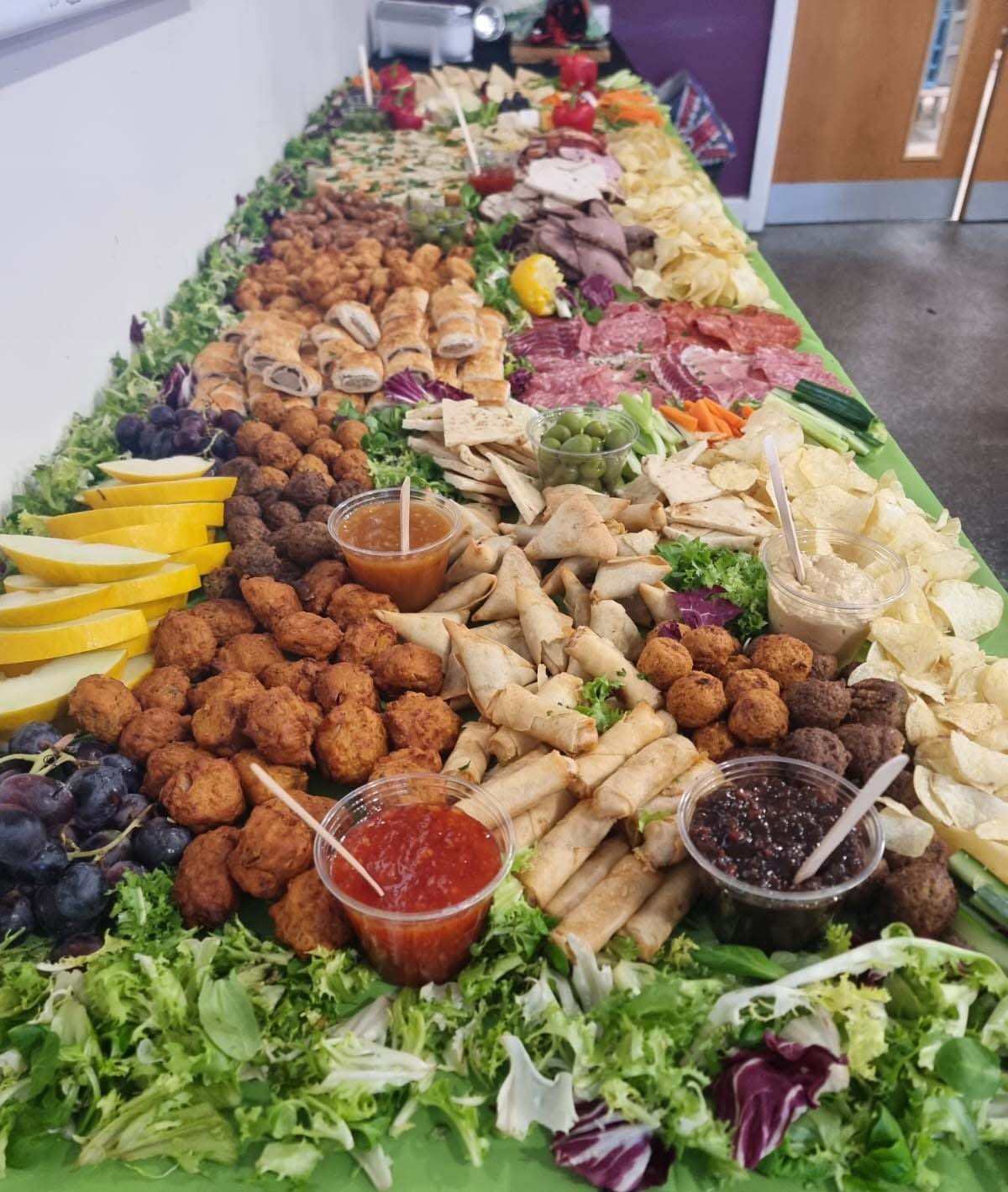 Spread of finger food on long table