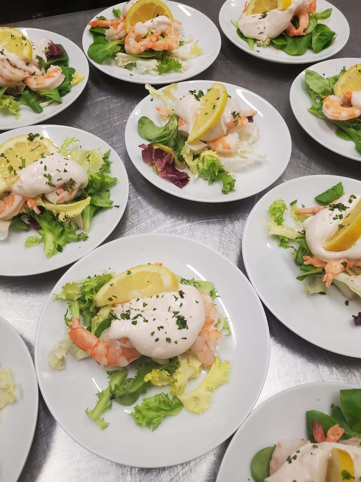 Prawn salad on white plates